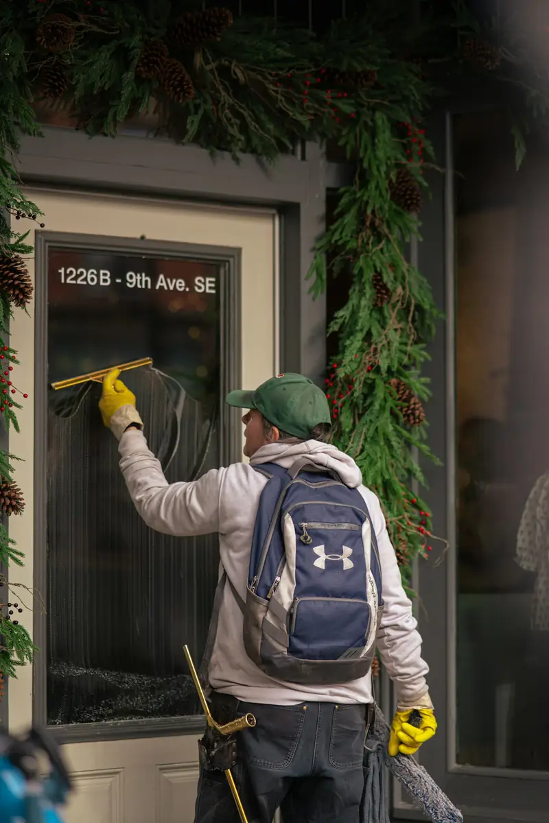 Window being cleaned with a squeegee